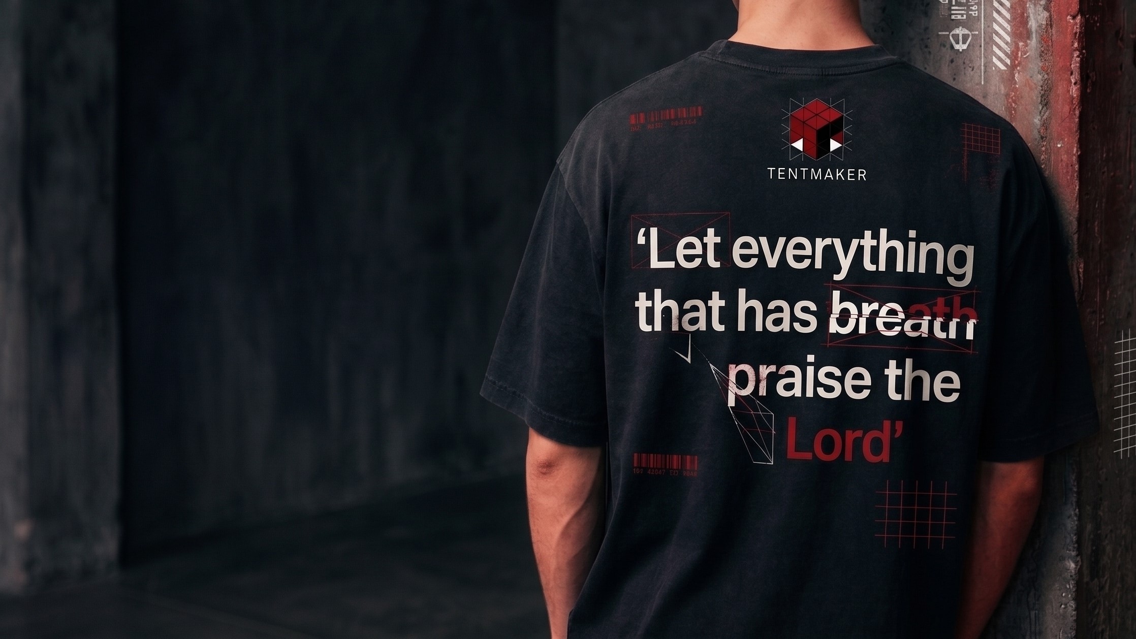 Drop 04 tee photographed from behind, back graphic in hard side light